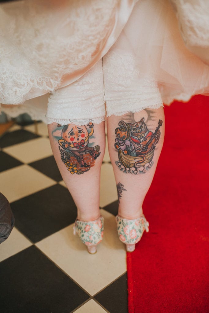 Tattooed bride at Warwickshire wedding