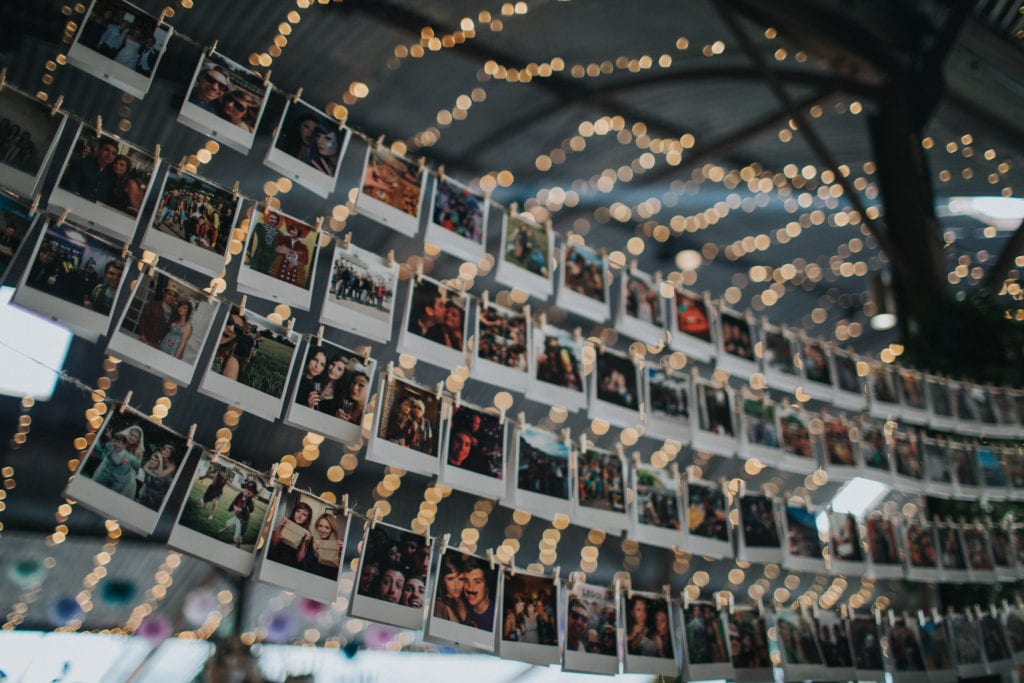 polaroid display at diy wedding in the cotswolds  