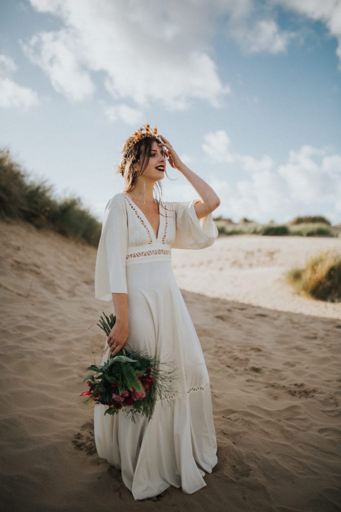 boho bride in vintage wedding dress at thromby beach
