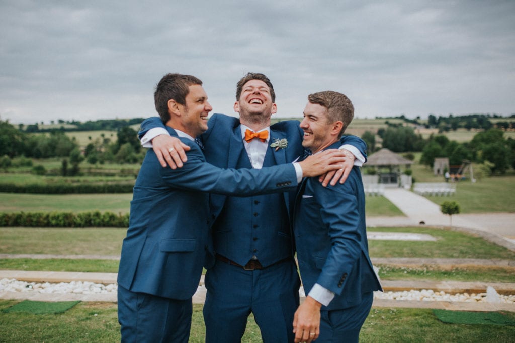 groom and best men in blue suits at the Yorkshire Wedding Barn