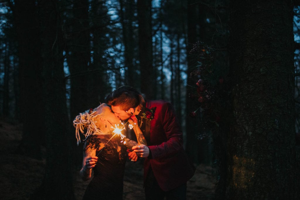 goth bride and groom with sparklers