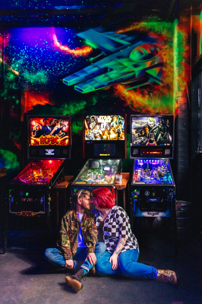 relaxed engagement photograph with arcade games in Digbeth, Birmingham.